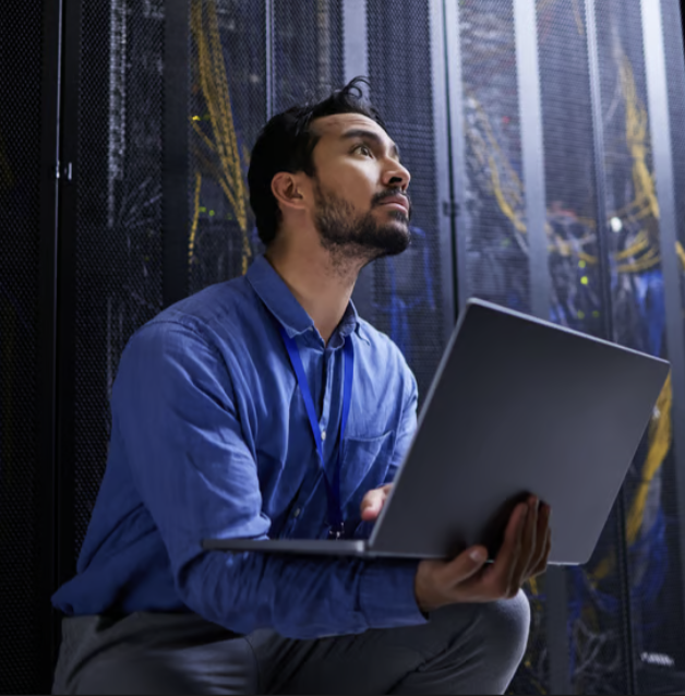 Engineer checking a rack in a data centre